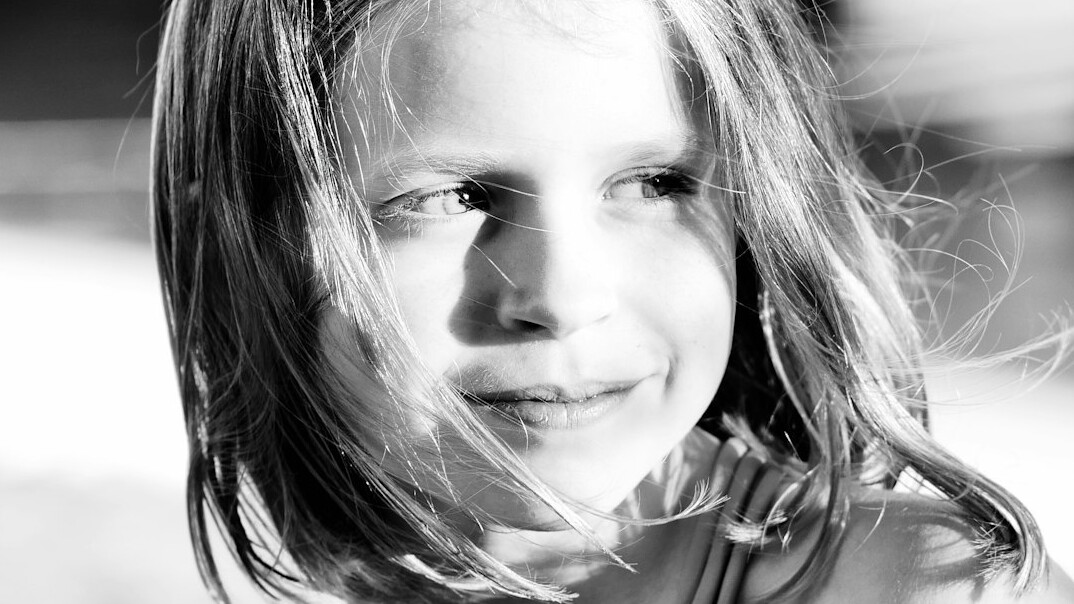 Portrait of a woman with long hair smiling