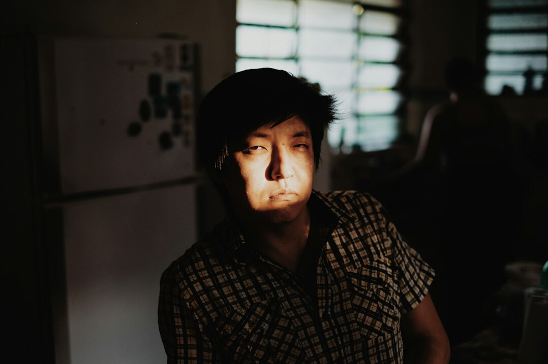 Portrait of a man in a shirt looking at camera
