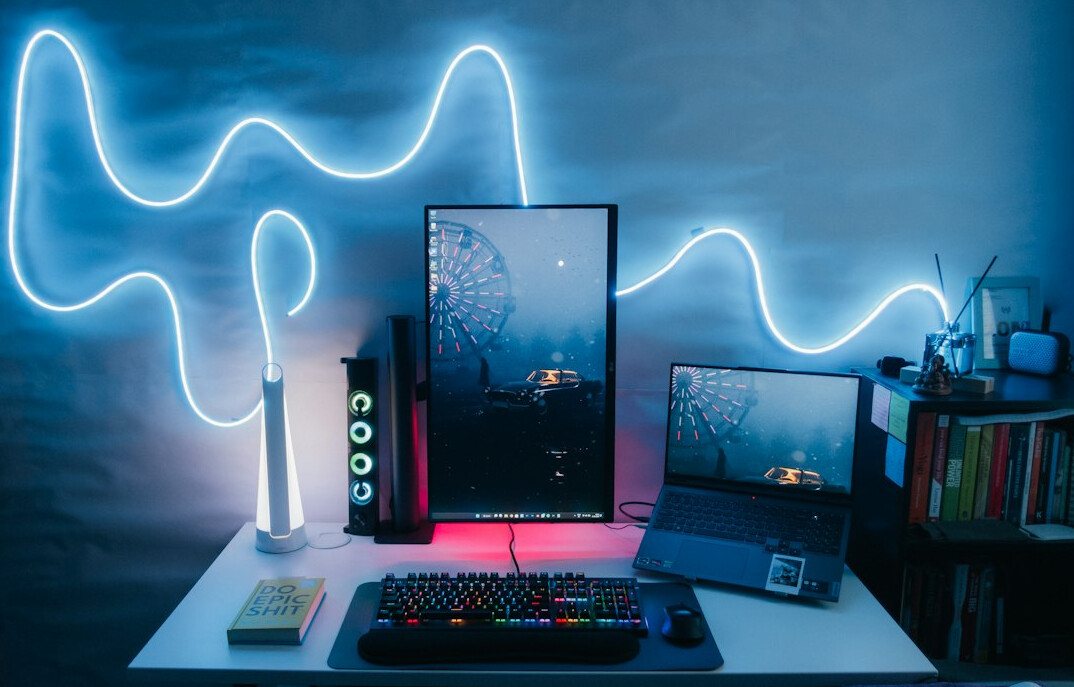 Developer workstation with two monitors and code